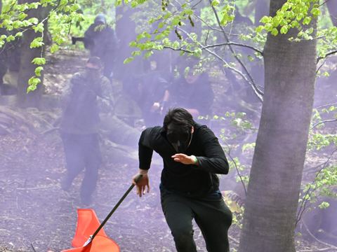 A player running through purple smoke