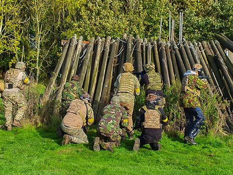 Players at a log fort