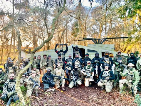 Group photo in front of the helicopter