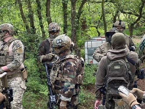 Players gathered in the woodland