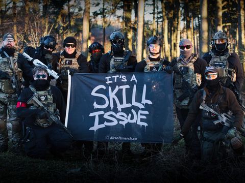 Players with a team flag in the woods