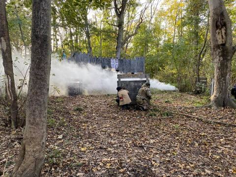 Players behind cover in the woods