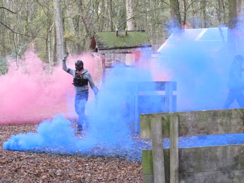 A player crossing coloured smoke