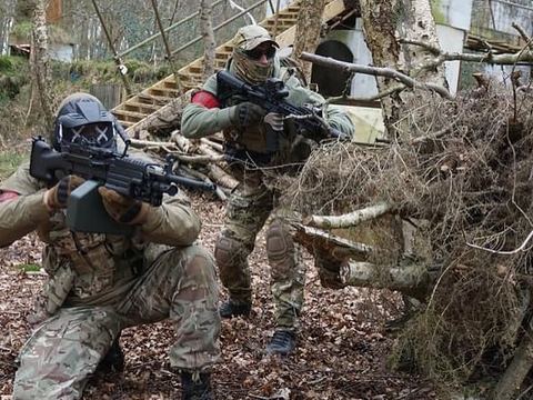 Players advancing through the woods
