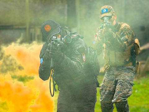 Two players in coloured smoke