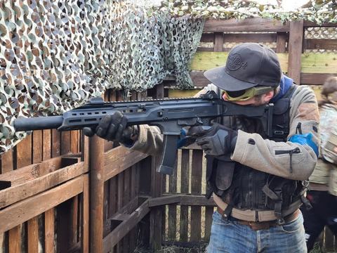 Player firing from a timber barricade