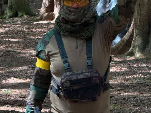 Player signalling on a woodland trail during a game day