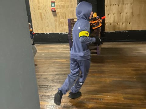 A player moving between the timber walls
