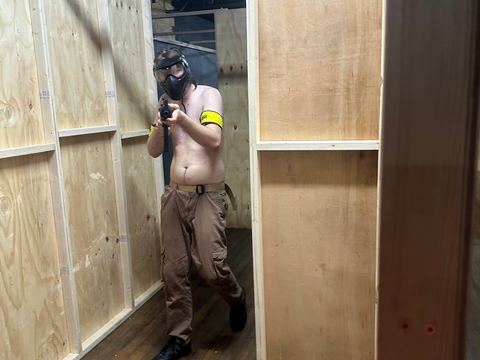 A player in a narrow timber corridor