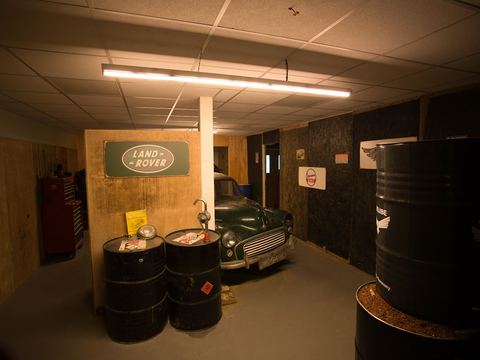 Ammo crates beside a heavy wooden door