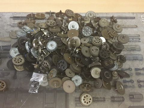 AEG gearbox gears laid out during a rebuild