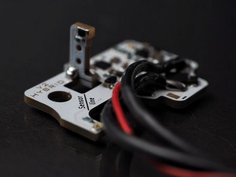 Close-up of an electronic trigger unit fitted during an upgrade