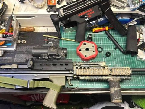 Rifle stripped down on the workshop bench mid-repair