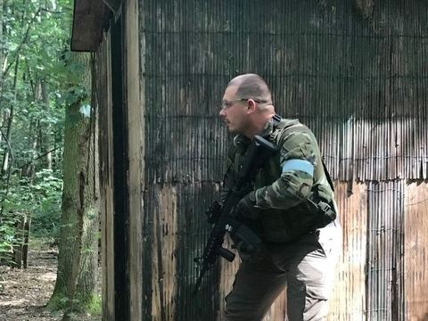 Moving past a wooden hut