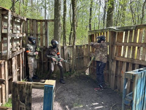 Players clearing a pallet built structure