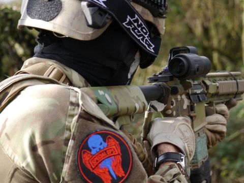 A player with a red dot sight