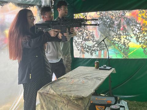 Guests trying the mobile range under a gazebo at an event