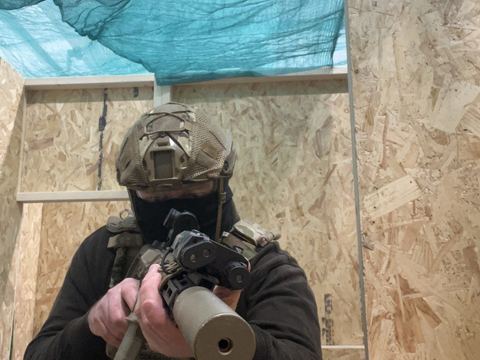 A player in the indoor Close Quarter Battle zone
