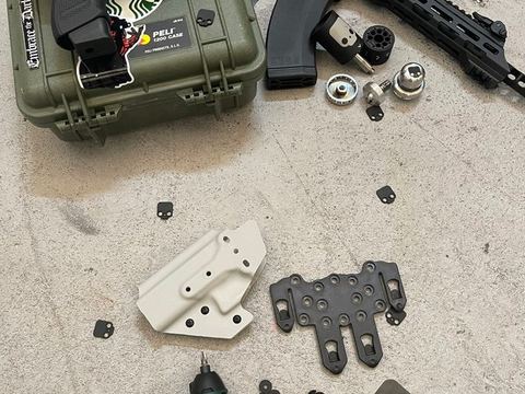 Holster parts and kit laid out on the workbench