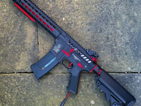 Red-accented custom rifle build