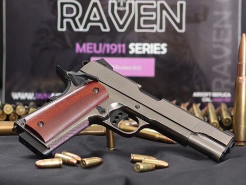 A Raven MEU 1911 series gas pistol with its box