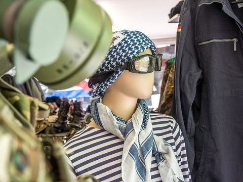 Shemagh, goggles and gas mask on a shop mannequin