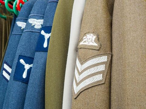Rails of military dress uniforms in the shop