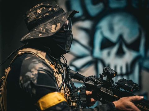 Player beside wall art in the arena