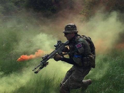 A player moving through coloured smoke