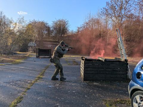 A player on the hardstanding with smoke behind