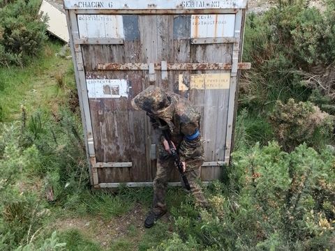 Player beside storage-crate cover on the heath