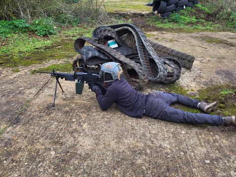 A player prone at a firing position
