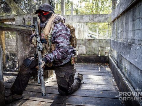 Player kneeling inside a wooden structure