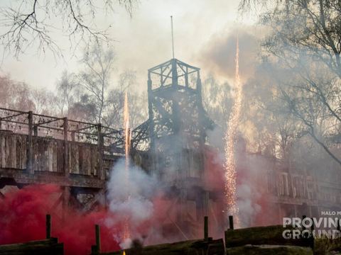 Bonfire night fireworks and coloured smoke over the wooden fort